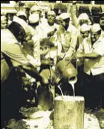  ?? PTI ?? Farmers pour milk on a road during a protest in Ahmednagar, Maharashtr­a