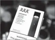  ?? SETH WENIG/AP 2018 ?? Juul had advertised e-cigarettes in print, TV, radio and online. E-cigs have been largely unregulate­d since 2007.