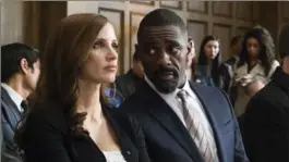 ?? MICHAEL GIBSON, STXFILMS ?? Jessica Chastain as Molly and Idris Elba as lawyer Charlie Jaffey in "Molly’s Game."