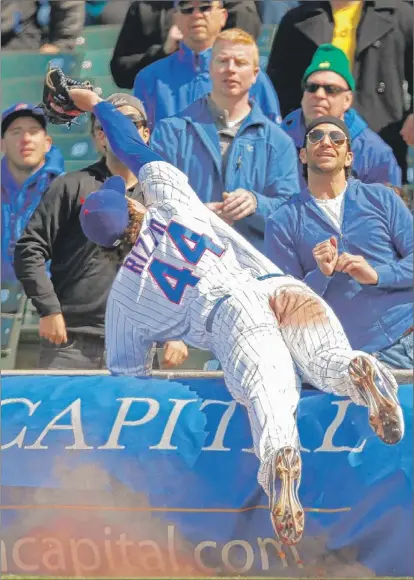  ?? | ANDREW A. NELLES~SUN-TIMES MEDIA ?? The Cubs’ Anthony Rizzo dives into the stands for a ball in the seventh inning.