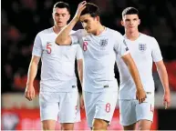  ?? GETTY ?? Michael Keane, Harry Maguire and Declan Rice look dejected after England’s defeat in Prague