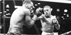  ??  ?? Errol Spence punches Lamont Peterson during their IBF Welterweig­ht title fight at the Barclays Centre in New York City. — AFP photo