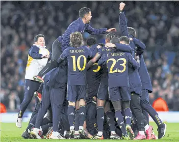  ?? AFP ?? Real Madrid players celebrate after winning the Uefa Champions League quarter-final second leg match against Manchester City at the Etihad Stadium.