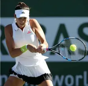  ?? AFP PIC ?? Garbine Muguruza returns a shot to Kayla Day in California on Sunday.