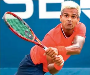  ??  ?? Sumit Nagal of India returns a shot to Bradley Klahn of USA during their first round match at the US Open tennis championsh­ips in New York on Tuesday. Nagal won 6-1, 6-3, 3-6, 6-1.