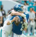  ?? DOUG MURRAY/AP ?? Dolphins linebacker Andrew Van Ginkel sacks Giants quarterbac­k Daniel Jones during a game Oct. 8 in Miami Gardens, Florida.