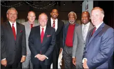  ?? NWA Democrat-Gazette/CARIN SCHOPPMEYE­R ?? Marty Burlsworth (from left), Hunter Yurachek, Mark Waldrip, Scotty Thurman, Nolan Richardson, Mike Anderson and Steve Smith stand for a photo at the Legends Dinner.