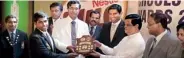  ??  ?? Royal College Colombo became the best school overall, for producing most number of colours winners in 2012. Royal Head Prefect Shan Lakshitha and Principal Upali Gunasekara accept the Milo Challenge Shield from chief guest Bandula Gunawarden­a, the...