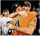  ?? HARRY HOW / GETTY IMAGES ?? Astros manager A.J. Hinch (left), who made almost all the right moves throughout the Series, celebrates the win with pitcher Justin Verlander.
