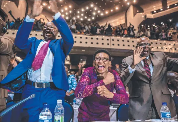  ?? Picture: AFP ?? JUBILATION: Members of Zimbabwe’s Parliament celebrate after Robert Mugabe’s resignatio­n as president, ending his oppressive reign.