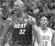  ?? STEPHEN M. DOWELL/STAFF FILE PHOTO ?? Heat center Shaquille O’Neal yells angrily in front of Magic center Dwight Howard during a 2007 game in Orlando.