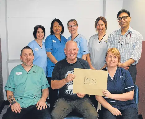  ??  ?? DUNDEE man Jim Irving visited Ninewells Hospital to hand over a cheque for £500 to staff in Ward 33.
Jim had a stroke nine years ago when he worked at NCR and credits his then-workmate Scott Ingram’s quick reaction for saving his life.
The money was...