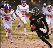  ?? MATT BATES — ENTERPRISE-RECORD ?? Paradise’s Stetson Morgan runs by Durham’s William McJunkin during the Bobcats’ matchup against Durham on Friday in Paradise.