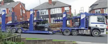  ??  ?? Arriving on the lower deck of a 12- car transporte­r, the MINI One was delivered in a Covid- safe manner while the country was in the first lockdown.