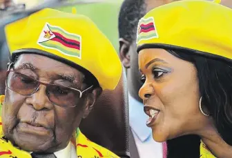  ?? Prezident Mugabe na snímku zkraje měsíce naslouchá své o 41 let mladší manželce Grace. FOTO REUTERS ?? Ambiciózní žena.