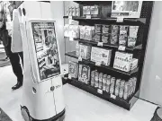  ?? [PHOTO BY ABHA BHATTARAI, THE WASHINGTON POST] ?? Lowe’s hardware stores use robots to restock shelves and guide customers to products.