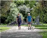  ?? ?? Irene and John Whittaker and their pooch Poppy have welcomed the winding, shady path. ‘‘The dog hates the sun,’’ says Irene.