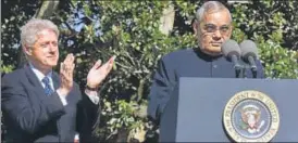  ?? PTI FILE ?? Former US president Bill Clinton applauds as Atal Bihari Vajpayee delivers a speech.