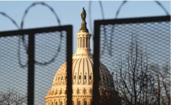  ?? GETTY ?? The U.S. Capitol is now surrounded by barbed wire fencing.