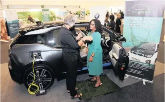  ?? COURTNEY AFRICA African News Agency (ANA) ?? THE Minister for Environmen­tal Affairs, Nomvula Mokonyane, gets a closer look at the BMW “Green Cab” during the Partnershi­p for Action on the Green Economy (Page) exhibition at the Cape Town Internatio­nal Convention Centre. |