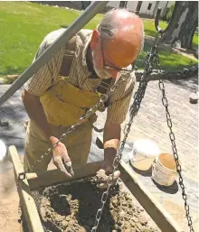  ??  ?? Paul Fink screens earth excavated from the sprinkler drainage; top, Fink examines a potsherd; photos Paul Weideman