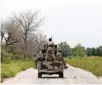  ?? - Reuters file photo ?? BLAME GAME: A military vehicle drives along the KondugaBam­a road in Bama, Borno, Nigeria. The rights group also accused Nigerian security forces of not doing enough to stop the killings.