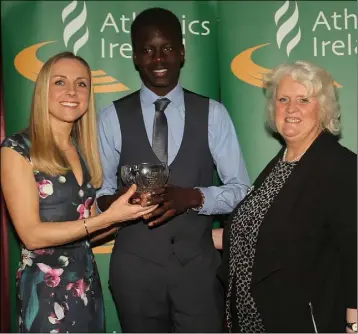  ??  ?? Wexford winner Peter O’Connor of Enniscorth­y Athletic Club receives his Athletics Ireland Emerald Crystal Star Award for 2016 from Georgina Drumm, President, Athletics Ireland, and Kerry O’Flaherty, Irish Olympian, at the Tullamore Court Hotel.