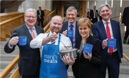  ??  ?? Nicola Sturgeon celebrates World Porridge Day with Mary’s Meals, a food charity that feeds hungry children across the world. Photograph: Martin Shields/PA