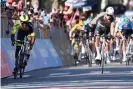  ?? Paolone/AP ?? Mathieu van der Poel gives a thumbs up as Biniam Girmay wins. Photograph: Massimo