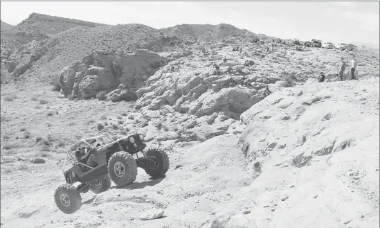  ?? David Undercoffl­er Los Angeles Times ?? A HEAVILY MODIFIED rock crawler climbs the infamous Potato Salad Hill trail, one of the most feared and treacherou­s rock inclines in Moab, Utah.