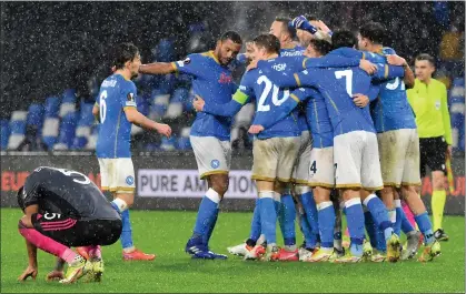  ?? ?? Leicester City’s Ryan Bertrand (left) cuts a dejected figure as Napoli celebrate their late winner