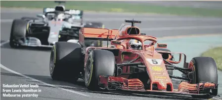  ??  ?? Sebastian Vettel leads from Lewis Hamilton in Melbourne yesterday