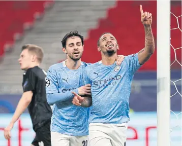  ?? REUTERS ?? Manchester City’s Gabriel Jesus, right, celebrates scoring their second goal with Bernardo Silva in Budapest.