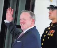  ?? Carlos Barria ?? Reuters Outgoing White House press secretary Sean Spicer waves as he walks into the White House on Friday.