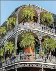  ?? ZACK SMITH PHOTOGRAPH­Y ?? New Orleans, which is 300 years old this year, is especially well known for its French Quarter and its wrought-iron balconies.