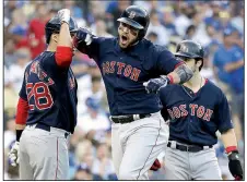  ?? AP/DAVID J. PHILLIP ?? Boston’s Steve Pearce celebrates with J.D. Martinez (left) and Andrew Benintendi after hitting a two-run home run in the first inning Sunday. Pearce added a home run in the eighth and was named the World Series MVP.