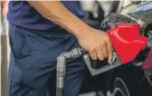  ?? BRANDON BELL/GETTY IMAGES FILE ?? AAA said the national average for a gallon of regular was $3.99 on Thursday, down from the mid-June record of $5.02.