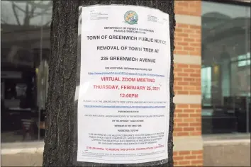  ?? Ned Gerard / Hearst Connecticu­t Media ?? A public notice hangs on the tree at 235 Greenwich Ave.