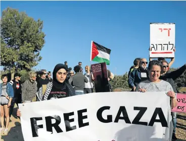  ?? /Reuters ?? Border protest: Activists take part in a protest in solidarity with Palestinia­ns living in Gaza, next to the Gaza-Israel border, near Kibbutz Nahal Oz in Israel.