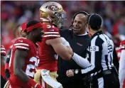  ?? KARL MONDON — BAY AREA NEWS GROUP, FILE ?? Defensive coordinato­r Robert Saleh welcomes Nick Bosa (97) back to the sideline during a 2020 game at Levi’s Stadium in Santa Clara.