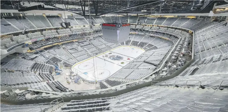  ?? JEFF NASH/EDMONTON OILERS ?? Rows of seats covered in plastic surround the ice surface at Rogers Place.