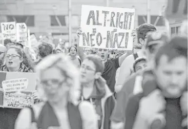  ?? Al Drago / New York Times ?? Demonstrat­ors march to the site of the annual “Become Who We Are” conference, a key gathering of the selfdeclar­ed “alt-right” movement, on Nov. 19 in Washington.