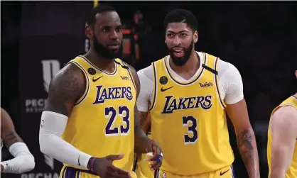  ?? Photograph: Mark J Terrill/AP ?? LeBron James and Anthony Davis’s LA Lakers are among the favourites to take the NBA title this year.