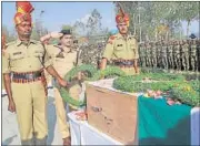  ?? WASEEM ANDRABI/HT PHOTO ?? Security personnel pay homage to a slain BSF soldier at a ceremony on the outskirts of Srinagar on Monday.