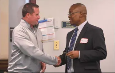  ?? ERIC BONZAR — THE MORNING JOURNAL ?? Anthony Richardson, program officer for The Nord Family Foundation, right, meets with Tony Dimacchia, operations director for the Boys and Girls Clubs of Lorain County and Lorain City Schools Board member, during the Lorain County After-School Time...