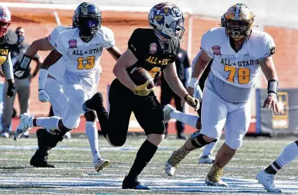  ?? Photos by Robin Jerstad / Contributo­r ?? Max DiDomenico of Team Black looks for running room around Team Gold’s En’Dreas Spriggs (13) and Kevin Godinez. An intercepti­on by DiDomenico led to a first-quarter touchdown for Team Black, which squandered a 17-point lead.