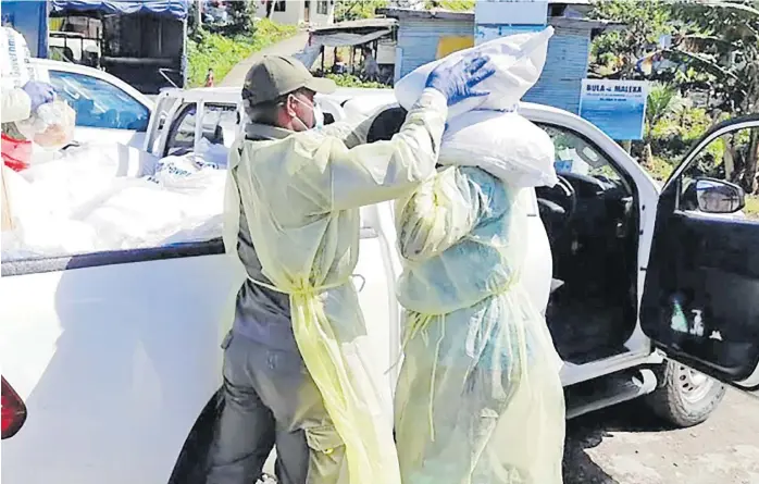  ?? Picture: FIJI GOVERNMENT/FACEBOOK ?? Food rations being distribute­d to Fiji households in lockdown areas.