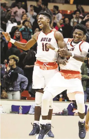  ?? Michael Ciaglo photos / Houston Chronicle ?? Bush forward Trevor Gulley, left, celebrates with Bradley Trevion after Bush beat Elkins 61-60 at Wheeler Fieldhouse last month. The two teams will face off again Friday.