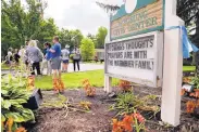  ?? JOHN MINCHILLO/ASSOCIATED PRESS ?? Supporters gather in Wyoming, Ohio, after Fred Warmbier, father of Otto Warmbier, imprisoned in North Korea in March 2016, speaks at a news conference Thursday.