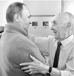  ??  ?? Putin (left) greets former head of the KGB intelligen­ce group in Dresden Lazar Matveev as he arrives to congratula­te his former supervisor on his 90th birthday, on the outskirts of Moscow. — AFP photo